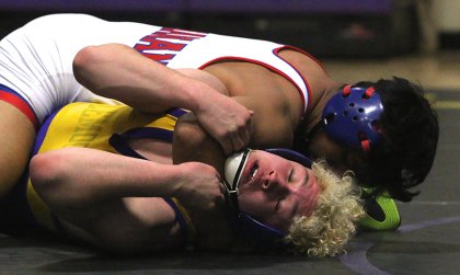 Lemoore's Will Kloster advanced in the consolations at Saturday's State Wrestling Tournament. Kloster is shown here in the Divisional battling Buchanan's Joel Romero, who eventually finished second in the state.